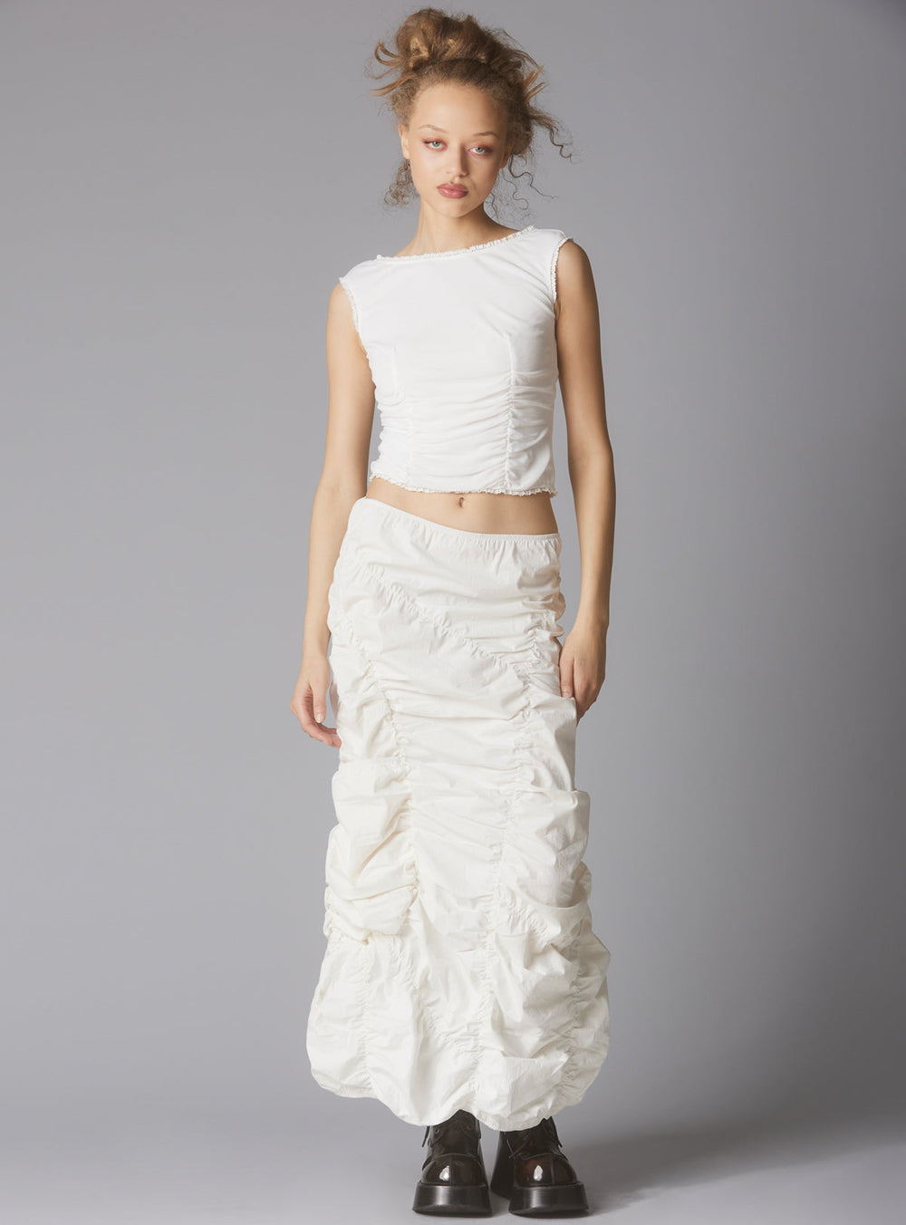 Sleeveless Top With Wide Neck & Ruffled Trim in White UNIF