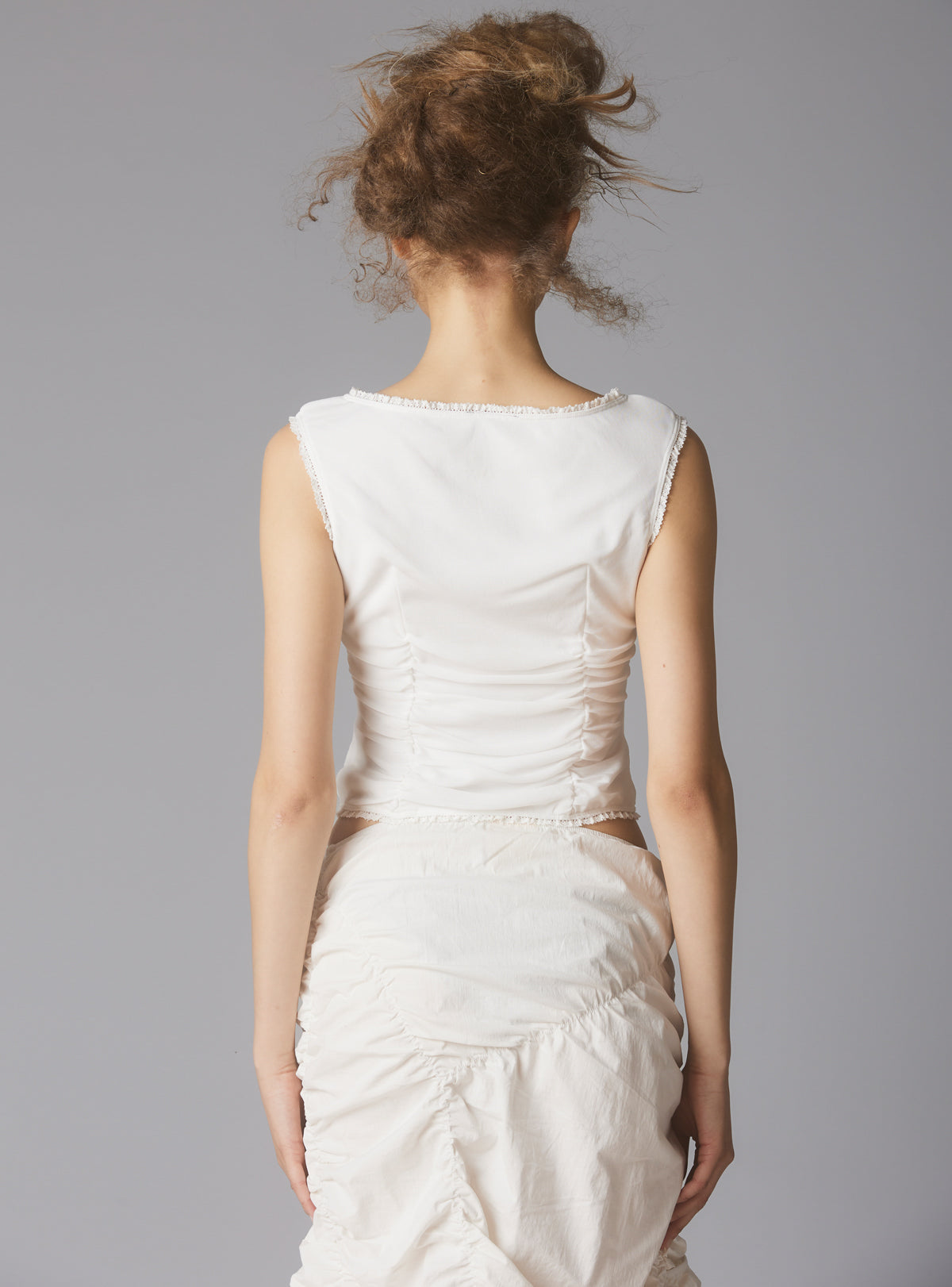 Sleeveless Top With Wide Neck & Ruffled Trim in White UNIF
