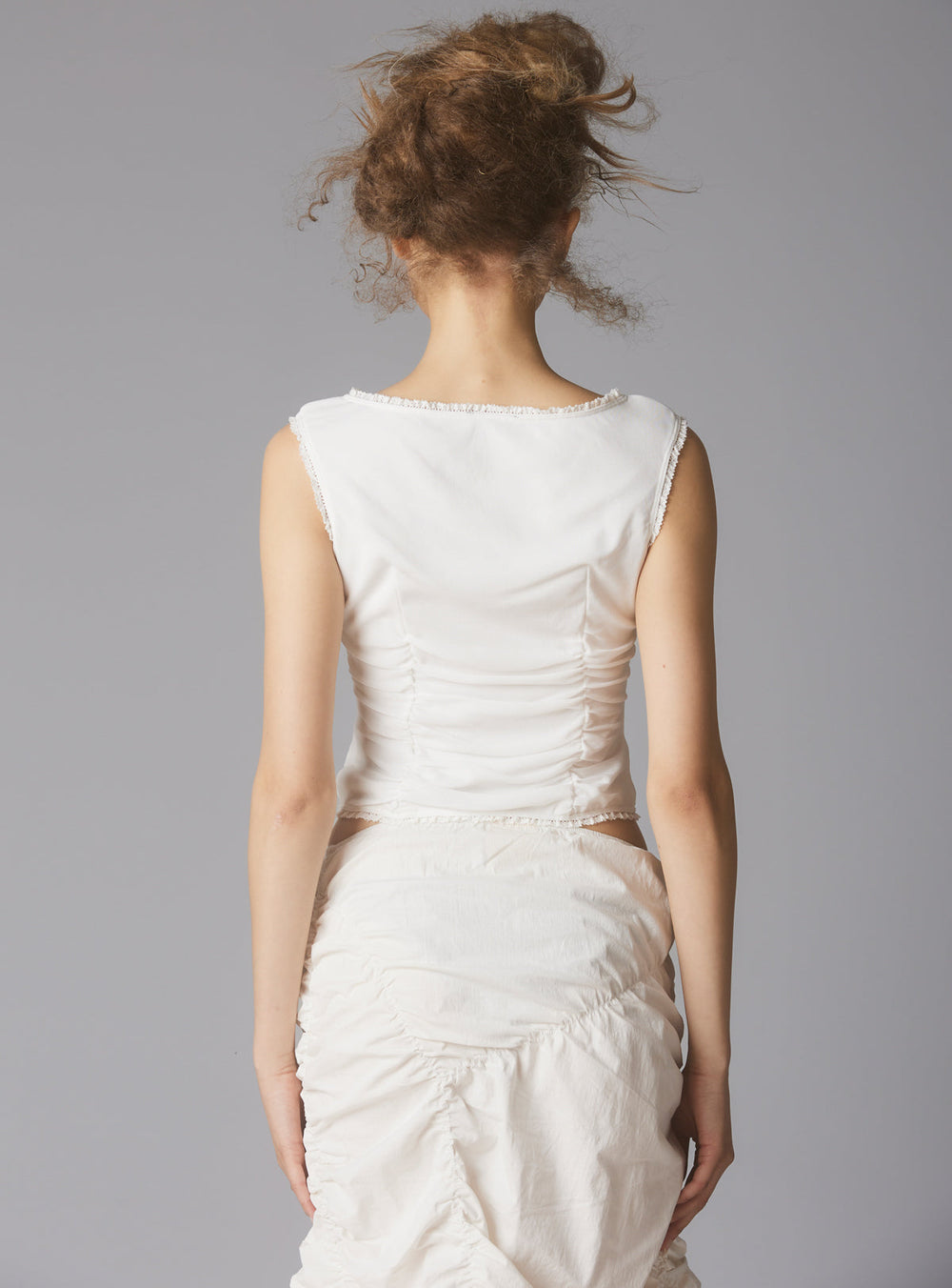 Sleeveless Top With Wide Neck & Ruffled Trim in White UNIF