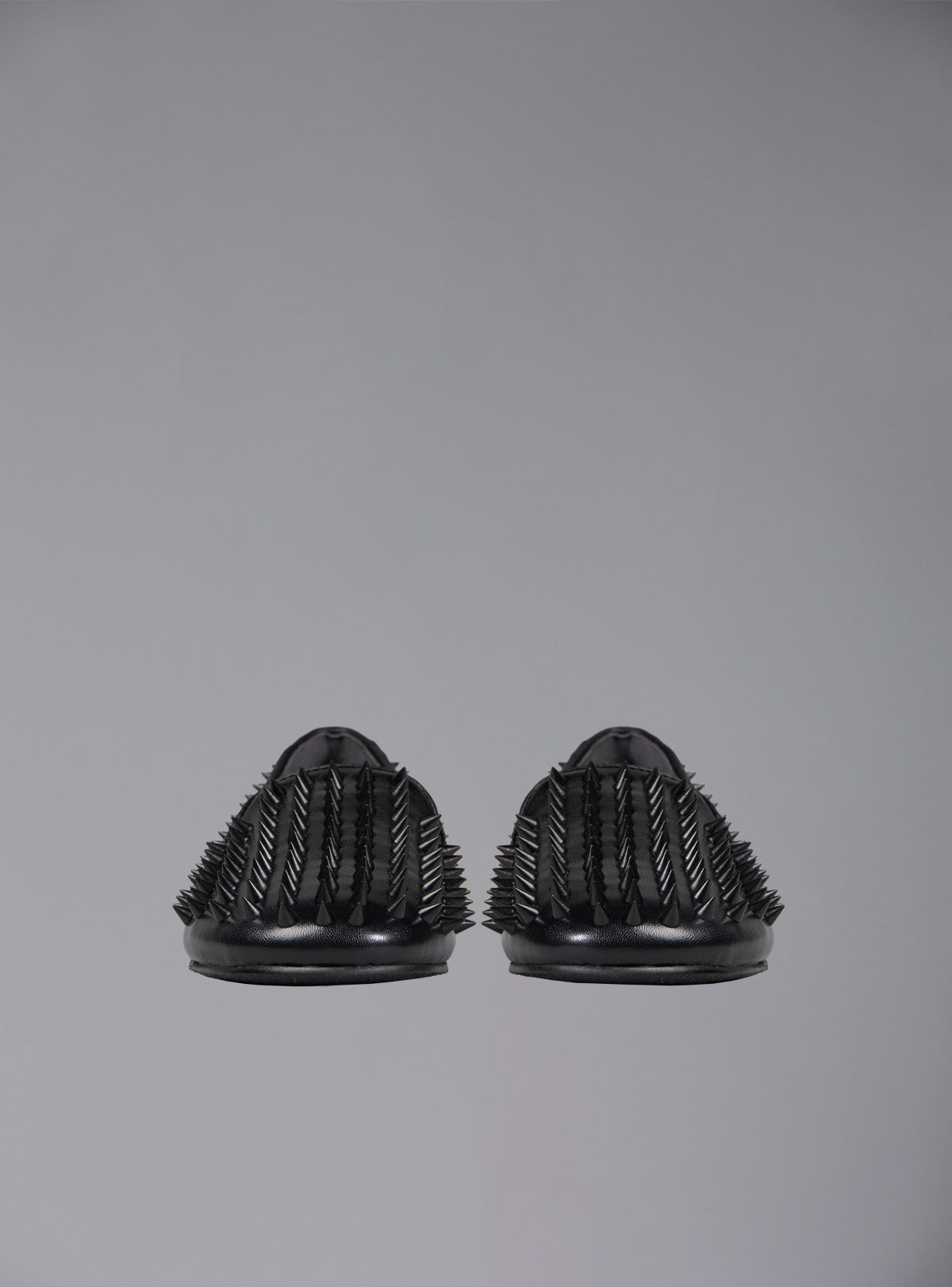 UNIF Hellraiser spiked slip on loafer in tonal black on black colorway.