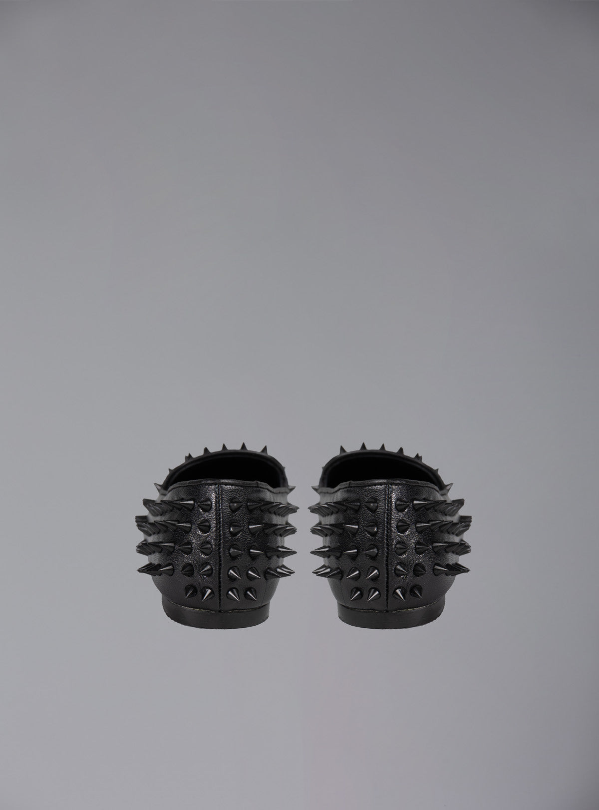 UNIF Hellraiser spiked slip on loafer in tonal black on black colorway.